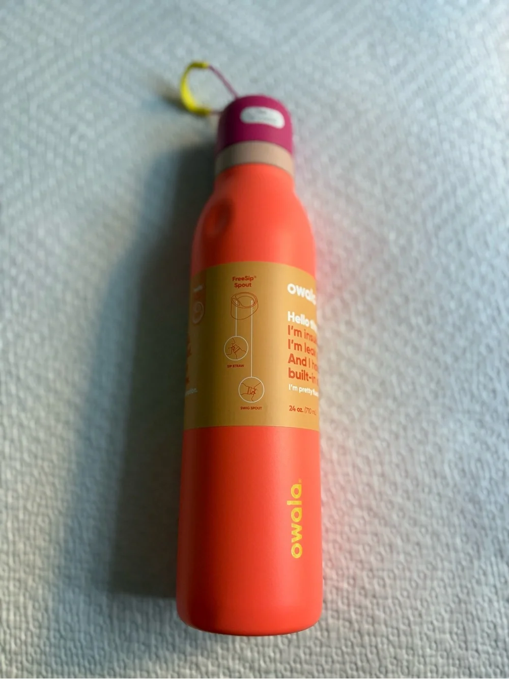 Owala Insulated Water Bottle in Coral with Pink Cap